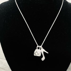 Traci Lynn! Necklace! Silver! High heel and purse on chain.